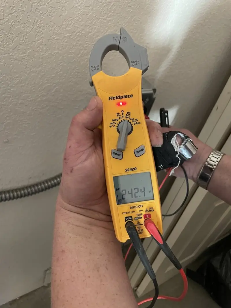 Voltage testing with clamp meter during Ceiling Fan Installation in Cannon Falls